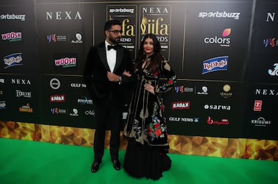 Aishwarya Rai Bachchan and her husband, Bollywood actor Abhishek Bachchan, on the green carpet in 2022. EPA