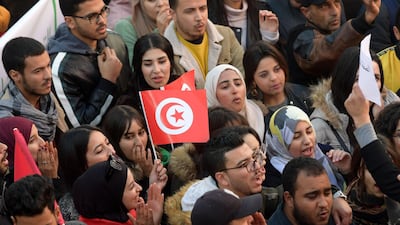 Tunisians take part in a rally marking the ninth anniversary of the 2011 uprising, at Habib Bourguiba Avenue in Tunis on January 14, 2020. AFP