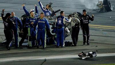 Crew members react after checking on Austin Dillon, the driver of the No 3 Bass Pro Shops Chevrolet, following an on-track incident during the Nascar race at Daytona International Speedway on Monday morning. Patrick Smith / Getty Images / AFP