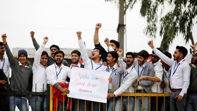 Indians turn out the welcome the captured pilot home. Reuters