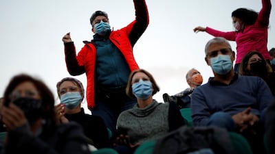 People dance at a concert.
