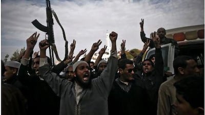 A crowd celebrates the expulsion of forces loyal to Muammar Qaddafi yesterday in Brega, Libya, a strategic oil port.
