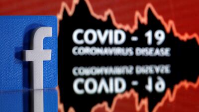 A 3D printed Facebook logo is seen in front of displayed coronavirus disease (COVID-19) words in this illustration; a campaign group found 40 per cent of false coronavirus information on the site remained online even after it was debunked Reuters