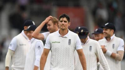England captain Alastair Cook is congratulated by team mates after the last wicket of Pakistan batsman Mohammad Amir had been taken to win the match during day four of the 2nd Investec Test match between England and Pakistan at Old Trafford on July 25, 2016 in Manchester, England. Stu Forster / Getty Images