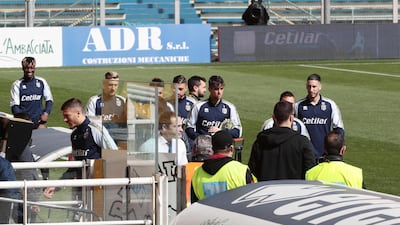Parma's players return to the dressing room as they wait to learn if their Serie A match against SPAL will go ahead after the Italian sports minister's calls for the league to be suspended due to the outbreak of coronavirus affecting much of northern Italy. EPA
