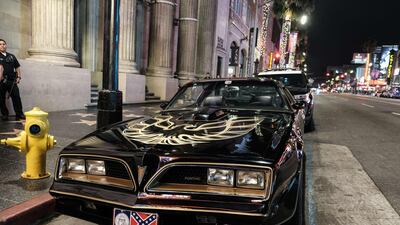 The Pontiac Firebird Trans Am from Burt Reynold's film "Smokey and the Bandit" is seen in front of Burt Reynold's star on the Hollywood Walk of Fame. AFP