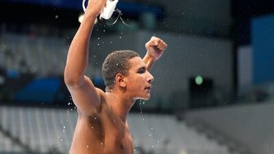 Ahmed Hafnaoui of Team Tunisia celebrates after winning the gold medal in the Men's 400m Freestyle Final on day two of the Tokyo 2020 Olympic Games.