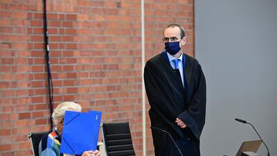 Defendant Josef Schuetz sits next to his lawyer Stefan Waterkamp as he waits for the start of his trial in Germany. AFP.