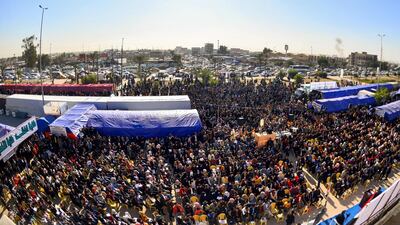 Protesters gather during an anti-government sit-in outside the gate of Kufa University in the holy Iraqi city of Najaf. AFP
