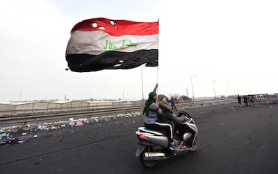 An Iraqi protester waves the Iraqi national flag during a protest in central Baghdad, Iraq, 23 January, 2020. EPA