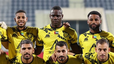 Italian striker Mario Balotelli, centre top, lines up alongside his Al Ittifaq teammates before the UAE First Division game against Al Arabi at Shabab Al Ahli Stadium, Dubai, on February 20, 2026.
