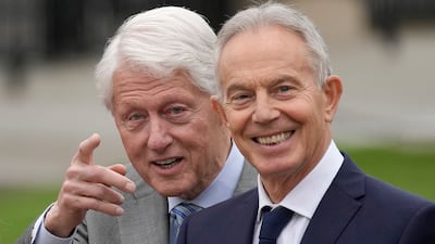 Former US president Bill Clinton stands beside Britain's former Prime Minister Tony Blair at Queen's University Belfast to mark the 25th anniversary of the Good Friday Agreement. AP