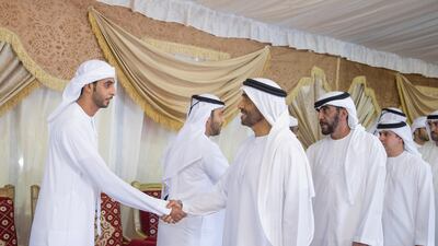 Sheikh Nahyan Bin Zayed, Chairman of the Board of Trustees of Zayed bin Sultan Al Nahyan Charitable and Humanitarian Foundation, third right, offers condolences to the family of martyr Mohammed Saeed Al Hassani, who passed away while serving with the UAE Armed Forces in Yemen. He is seen with Staff Major General Juma Al Bowardi, Commander of the UAE Armed Forces Land Forces, second right. Mohamed Al Hammadi / Crown Prince Court - Abu Dhabi