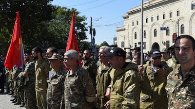 People attend a meeting to recruit military volunteers after Armenian authorities declared martial law and mobilised its male population following clashes with Azerbaijan over the breakaway Nagorno-Karabakh region in Yerevan, Armenia. Reuters