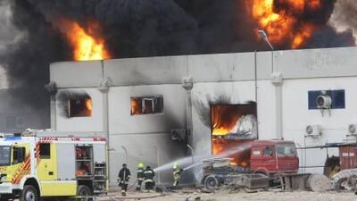 Flames and smoke pour from a burning National Paints Factory in Al Dhaid road, Al Sharjah.
