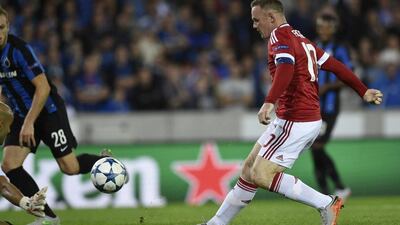 Manchester United's Wayne Rooney scores the opening goal against Club Brugge in their 4-0 victory in the Champions League on Wednesday night. John Thys / AFP / August 26, 2015