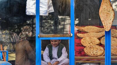 An Afghan child looks out from inside a restaurant in the Fayzabad district of Badakhshan province. AFP