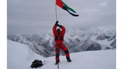 Salah al Habsi plants the UAE flag on top of mount Cho Oyu in China, the world´s sixth-highest peak.