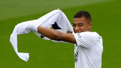 Kylian Mbappe arrives for PSG's training session. AFP