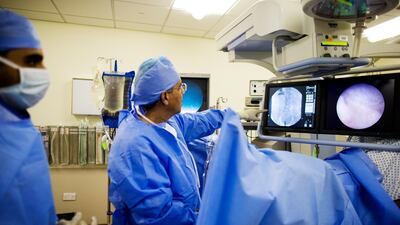 Doctors carry out an assessment for a prostate patient at Mafraq Hospital in 2013. Christopher Pike for The National