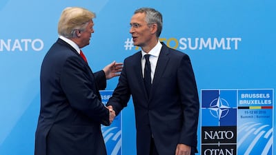 President Donald Trump is greeted by NATO Secretary General Jens Stoltenberg before a summit of heads of state and government at NATO headquarters in Brussels. Pool via Reuters