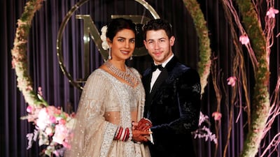 Newlyweds Priyanka Chopra, 36, and Nick Jonas, 26, pose for a photograph during a reception at a hotel in New Delhi on December 4, 2018. Photo: Reuters