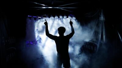Washington's David Crisp runs onto the court before the team's NCAA college basketball game against Oregon in the final of the Pac-12 men's tournament in Las Vegas. AP