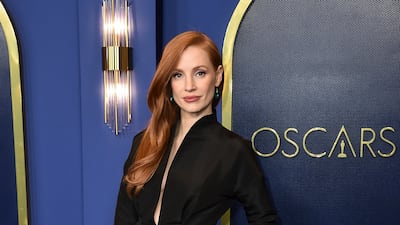 Jessica Chastain, in a black Gucci dress with a plunging neckline, arrives at the 94th Academy Awards nominees luncheon on March 7, 2022, in Los Angeles. AP