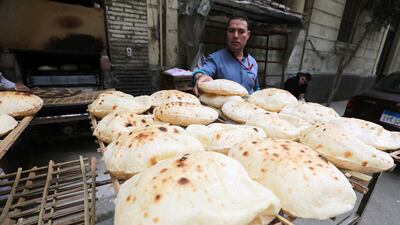 A man buys bread from a bakery in Cairo. Egypt is facing a potentially destabilising rise in food prices. EPA