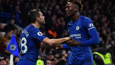 Chelsea defender Cesar Azpilicueta celebrates scoring his team's second goal with Tammy Abraham. AFP