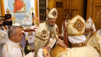 Father Abraham conducts the orthodox Christmas service at the St. Anthony's Cathedral in Abu Dhabi. (Khushnum Bhandari/ The National)