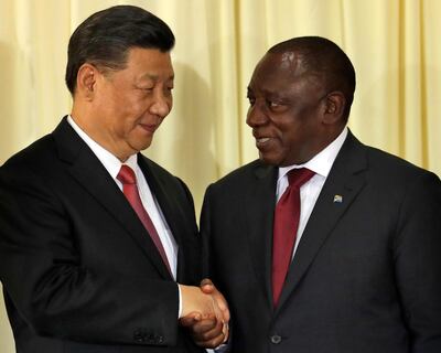 South African President Cyril Ramaphosa, right, shakes hand with Chinese President Xi Jinping ahead of the three-day Brics Summit starting Wednesday in Johannesburg. AP