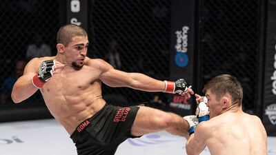 Mochamed Machaev lands a high kick on Bagdos Olzhabay during their contest at Eithad Arena on March 18, 2023. UAE Warriors