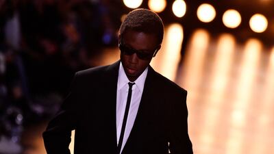 Skinny ties and white shirts added depth to some of the looks. AFP