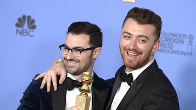 UK singers Sam Smith, right, and Jimmy Napes, left, hold the award for Best Original Song-Motion Picture for Writing’s on the Wall in the press room during 73rd Annual Golden Globe Awards. Paul Buck / EPA