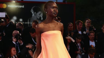 HIT: Alek Wek looks sublime in a strapless peach gown.