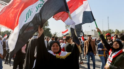 Flag-waving protesters near parliament in the Iraqi capital. Reuters