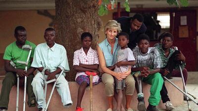 Diana, Princess Of Wales with children injured by mines at Neves Bendinha Orthopaedic Workshop In Luanda, Angola. Getty Images