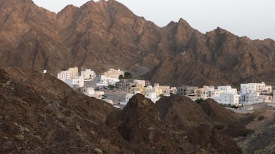 A backdrop of craggy mountains surrounds the luxury retreat.