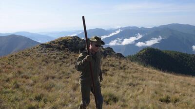 Russian President Vladimir Putin walks during his leisure time in the Siberian Taiga area. AFP