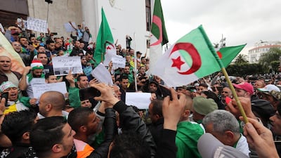 Algerian protesters shout slogans during a demonstration demanding for the departure of the entire Algerian regime, in Algiers. EPA