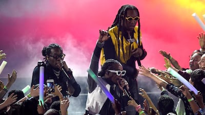 Offset, from left, Quavo and Takeoff, of Migos, perform. AP
