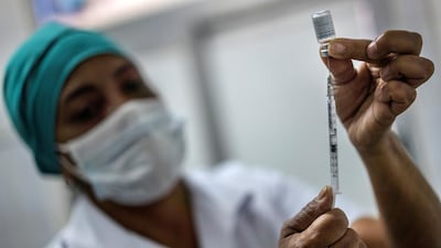 A nurse prepares a domestically produced Soberana 2 vaccine at the Heroes del Corinthia polyclinic in Havana, Cuba. EPA-EFE