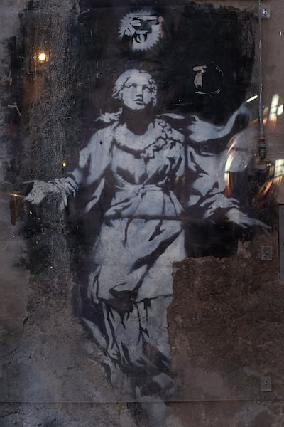 Madonna with the Pistol is the only Banksy piece in Italy that remains where it was originally stencilled. AFP