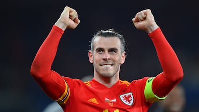 Gareth Bale celebrates after Wales's victory in the 2022 World Cup play-off against Austria at Cardiff City Stadium in March 2022. Getty