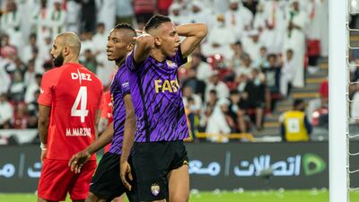 Al Ain players show their frustration after missing a chance.