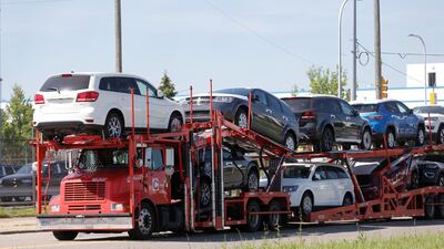 A car hauler transports Chrysler vehicles to a holding lot from the FCA Jefferson North Assembly Plant in Detroit, Michigan, Production of motor vehicles and parts decreased 6.5 per cent after falling 2.2 per cent the prior month REUTERS/Rebecca Cook/File Photo