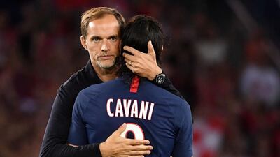 Paris Saint-Germain's German coach Thomas Tuchel (L) greets Paris Saint-Germain's Uruguayan forward Edinson Cavani at the end of the match. AFP