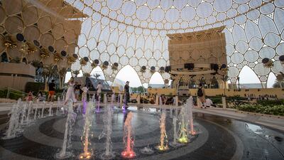 People wait for the light show at the opening of Al Wasl Dome.