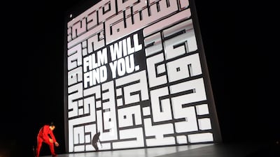 An artist performs during the opening ceremony of the 14th Dubai International Film Festival on December 6, 2017. Patrick Baz / AFP